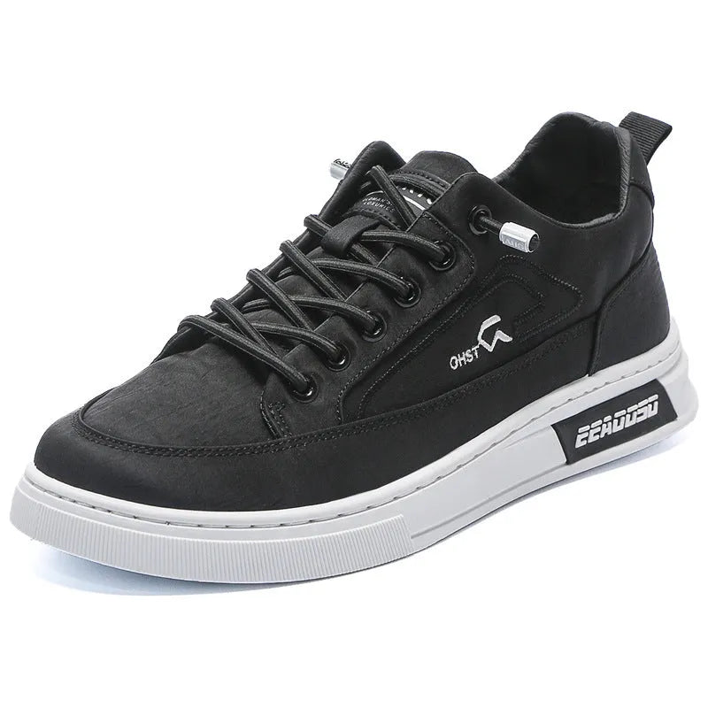 Grey men's canvas lace-up sneakers with stitching detail and a low-top round toe design.
