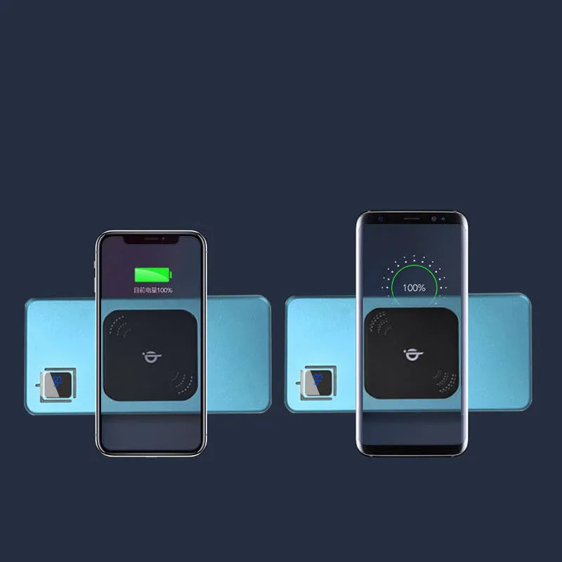 Silver portable power bank with LCD display showing battery percentage, placed next to a smartphone.