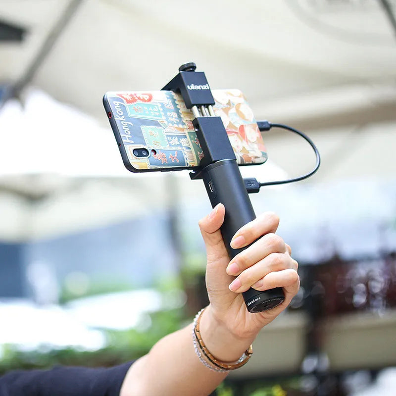 Black aluminium power bank with carry handle showing 6800mAh capacity