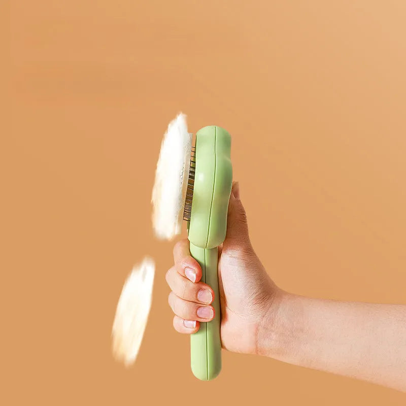 Green and yellow self-cleaning stainless steel cat comb grooming tool measuring 20 cm.