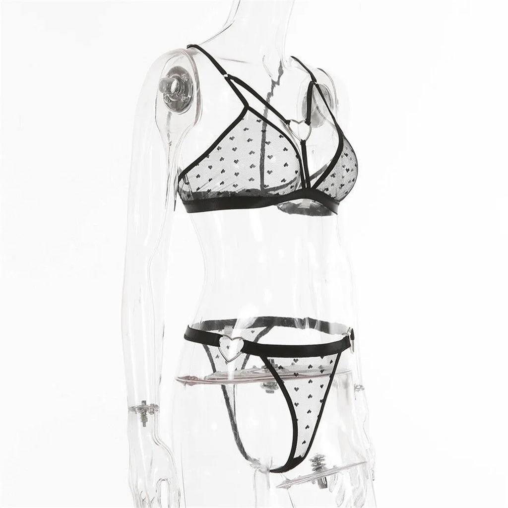 Ladies' black mesh two-piece spandex set showing top and matching pants on a hanger.