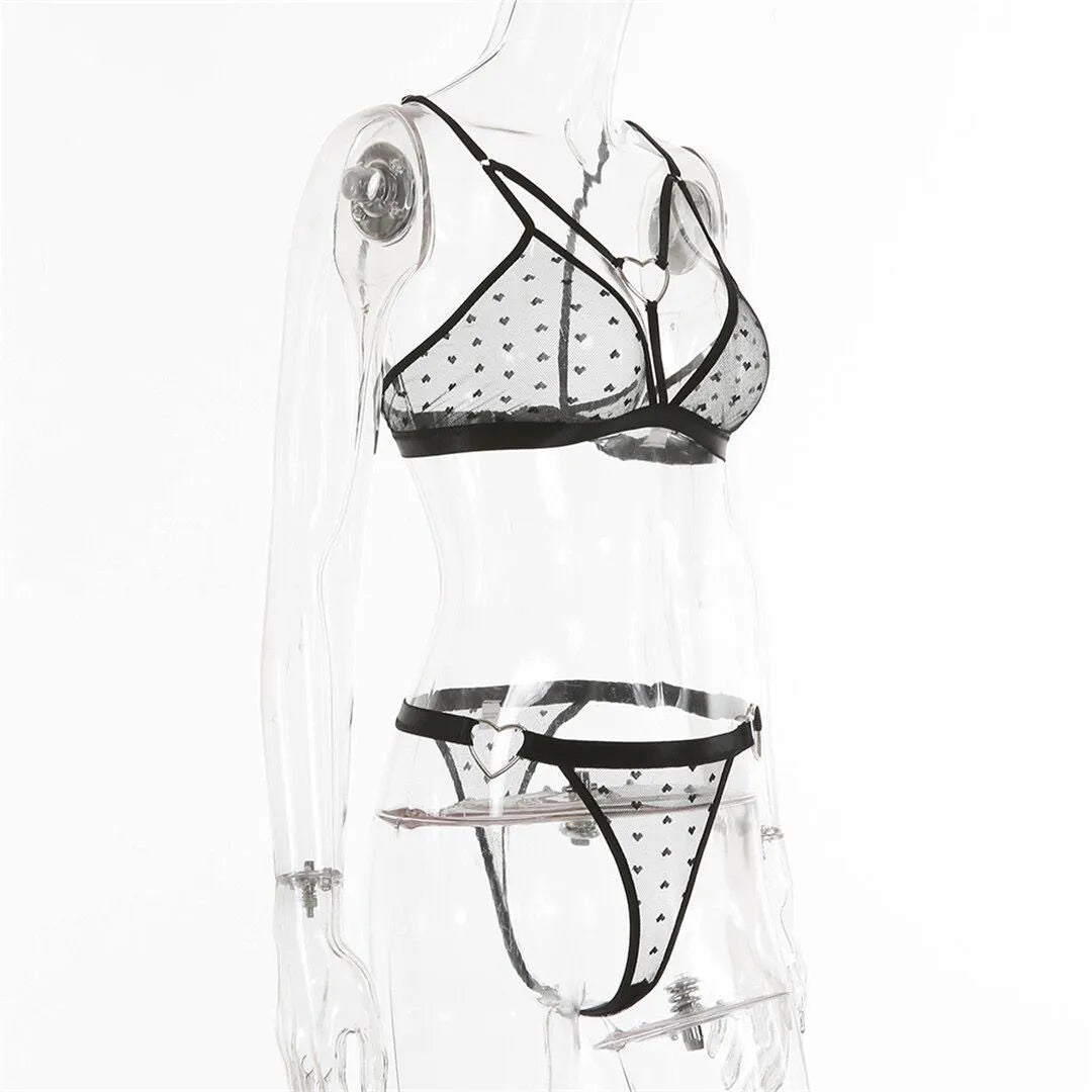 Ladies' black mesh two-piece spandex set showing top and matching pants on a hanger.