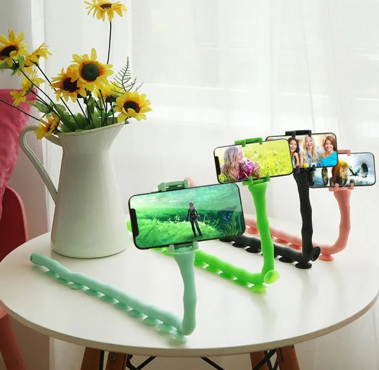 Flexible rubber phone holder with suction cup base showing 360 degree rotation capability