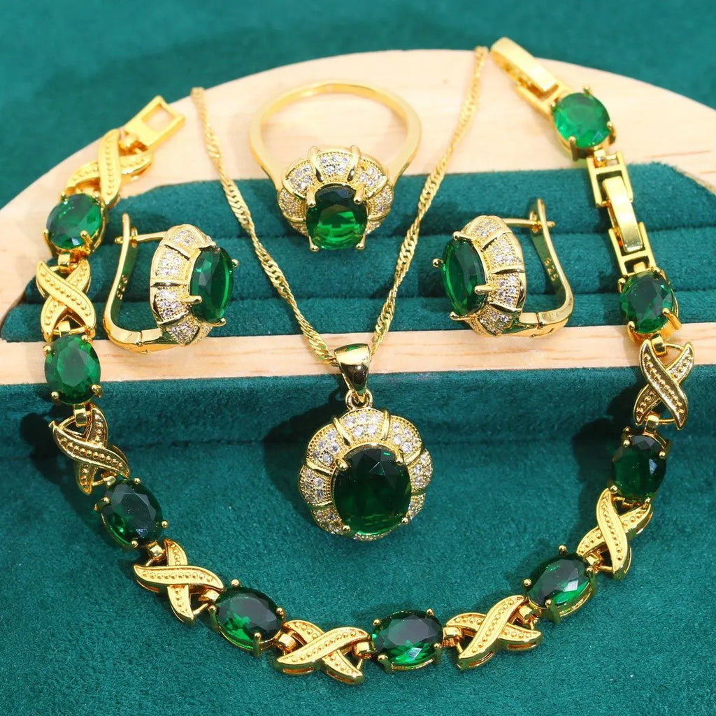 18k gold plated jewellery set with coloured cubic zirconia stones, showing necklace, earrings, ring, and bracelet.