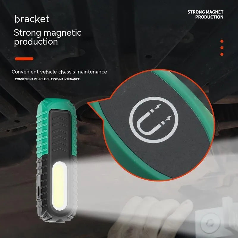 Black and green USB auto repair work light with compact design for workshop use