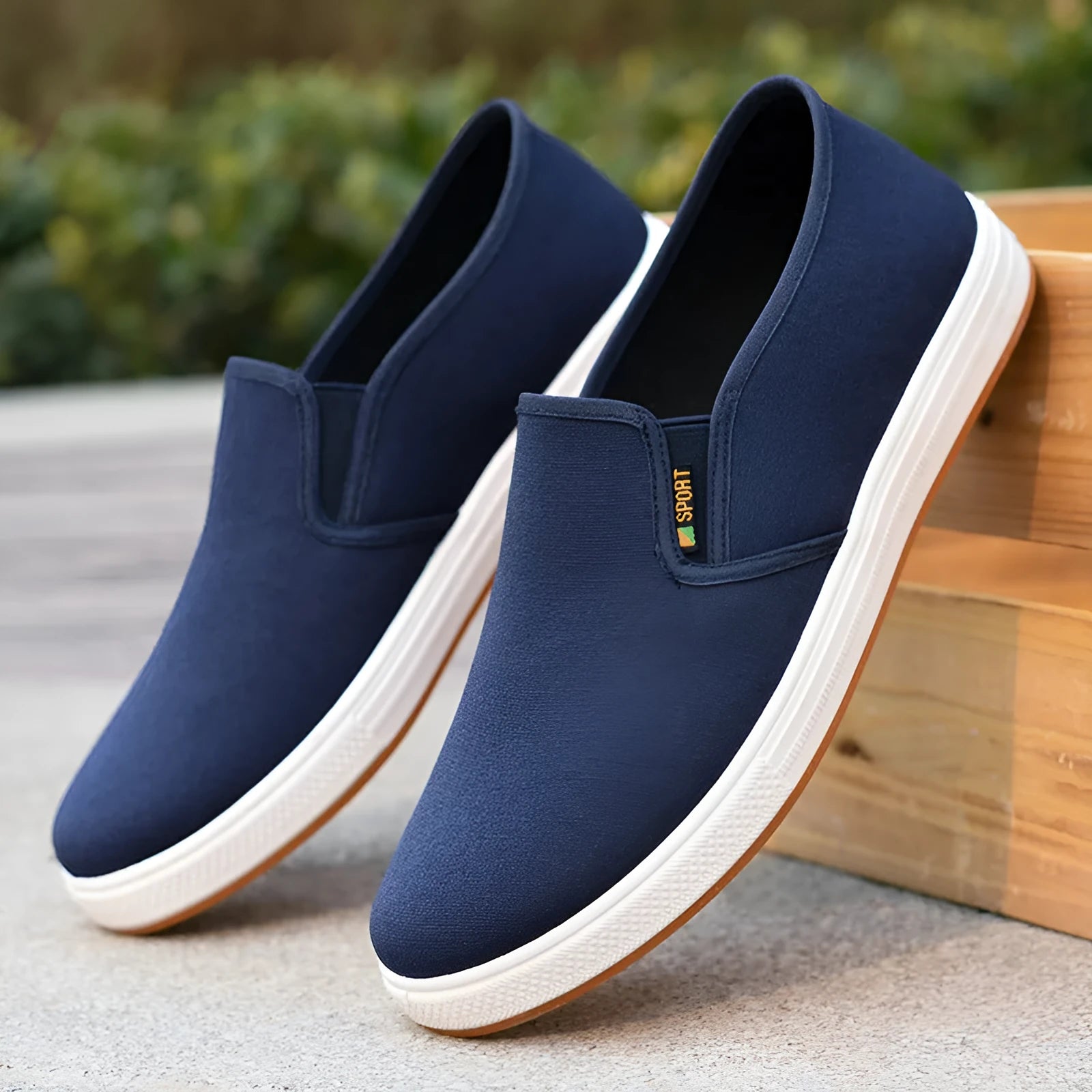 Men's black and blue canvas slip-on shoes with round toe and low-top design