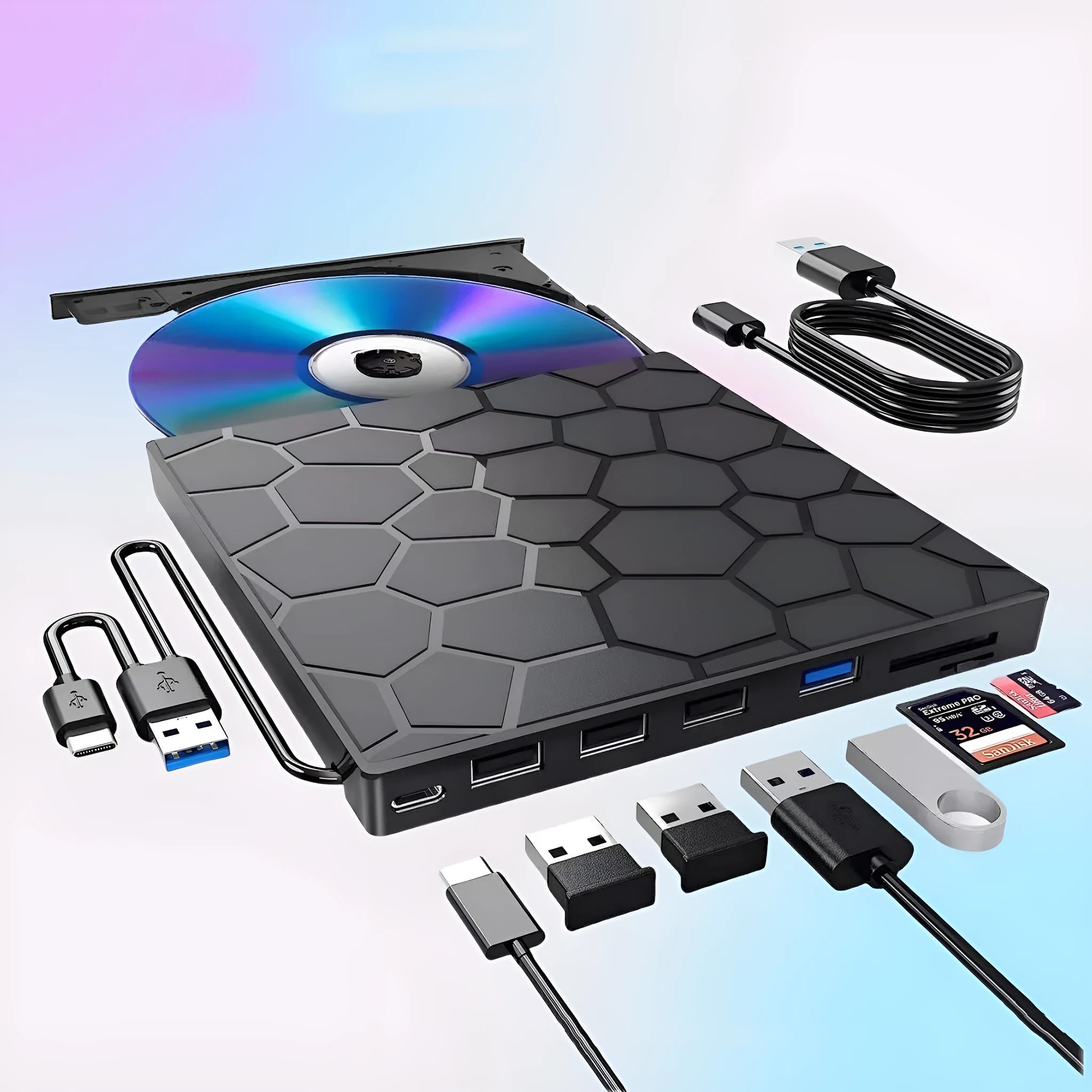 Black external USB CD DVD writer drive on a desk next to a laptop