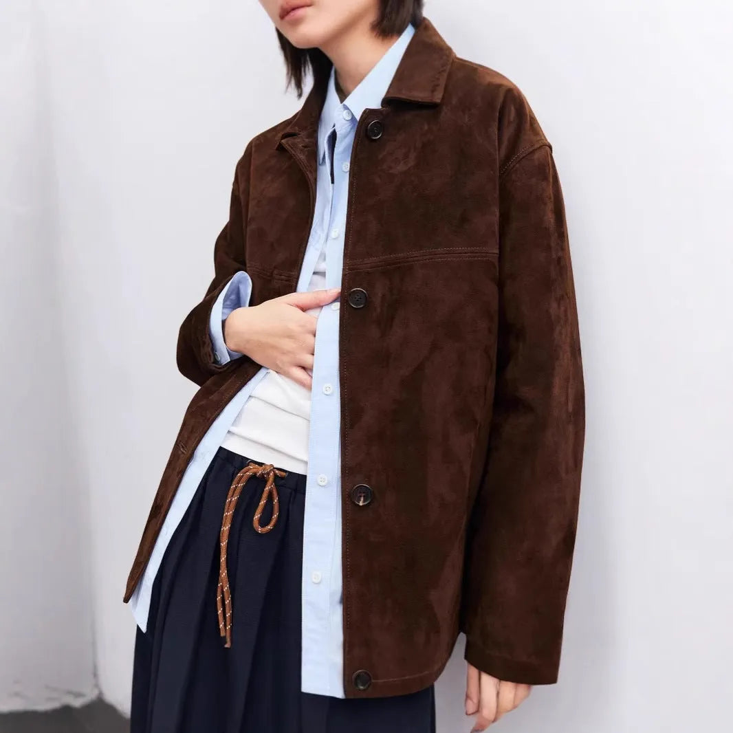 Yellow brown retro-style women's cashmere coat with a Peter Pan collar, leather stitching, and a belt.