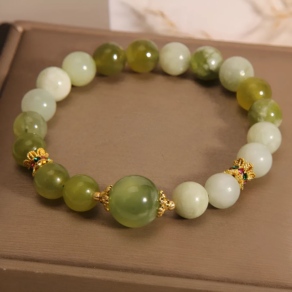 Original design women's bracelet made from green Xiuyan jade in a sweet Mori style.