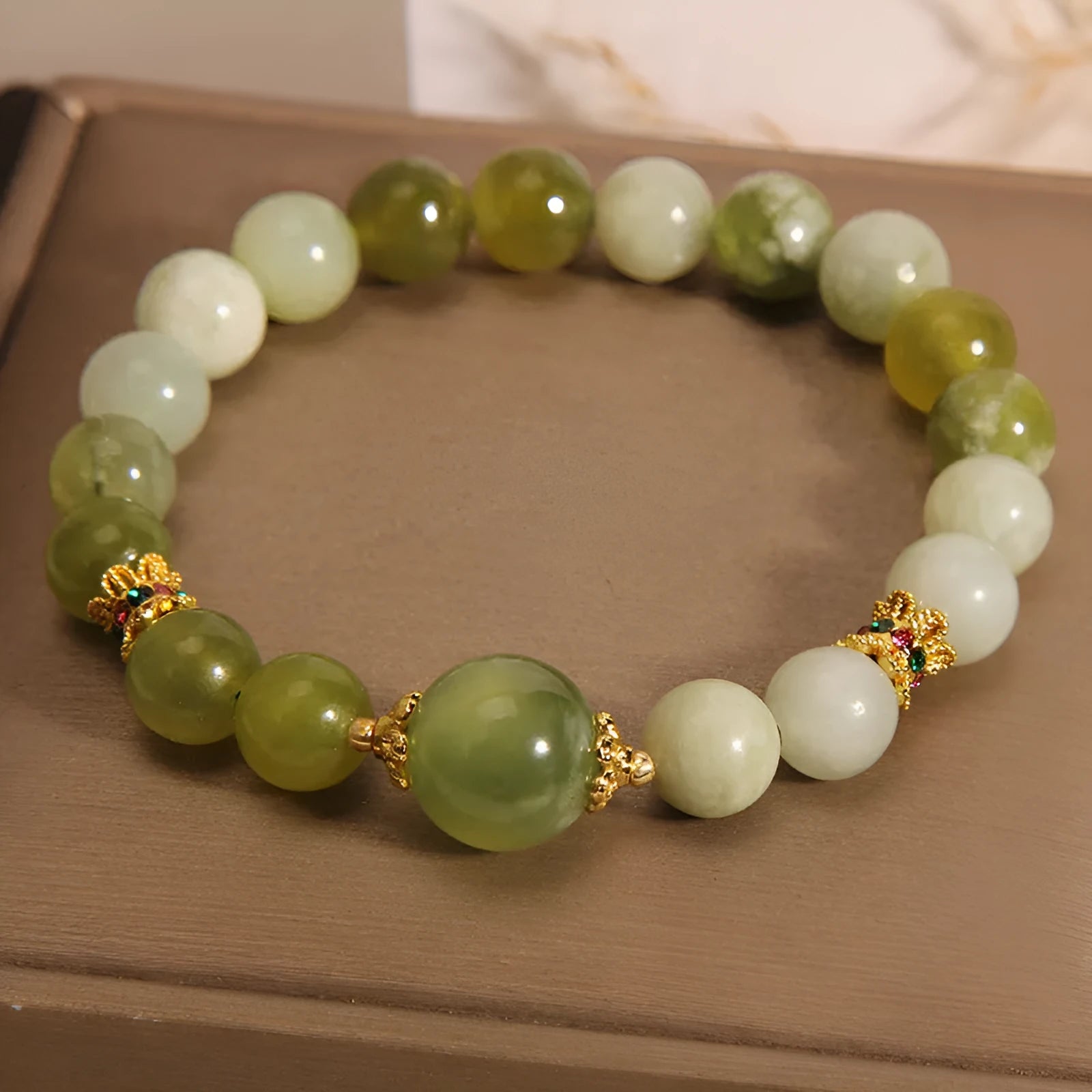 Original design women's bracelet made from green Xiuyan jade in a sweet Mori style.
