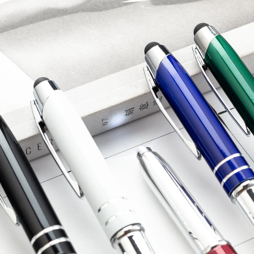 Red metal capacitive stylus and ballpoint pen with built-in LED light, shown with bullet-type nib.