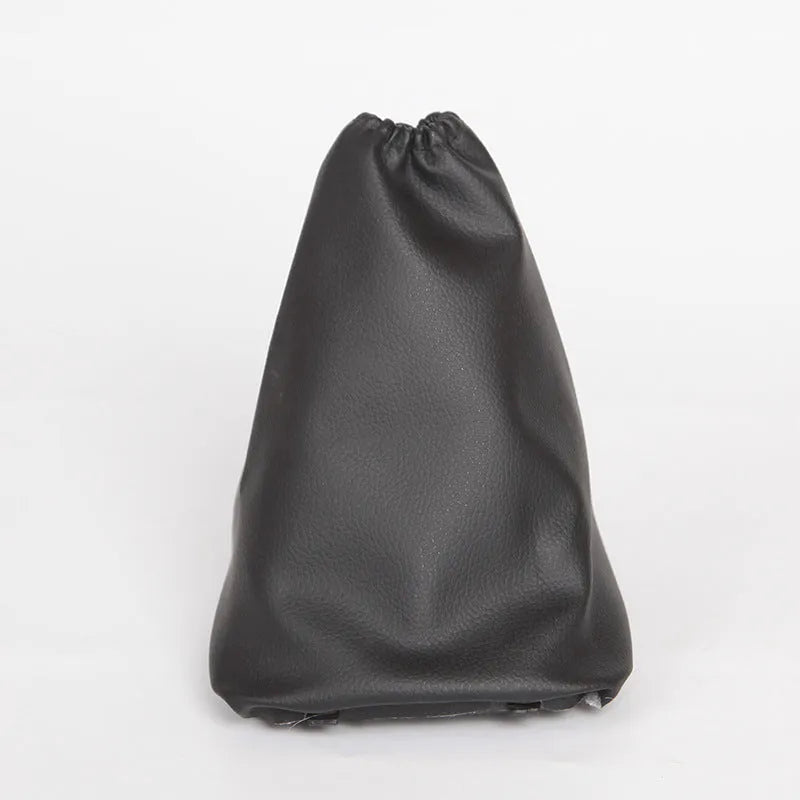 Black leather dust cover for Toyota Corolla gear shift lever, shown beside vehicle interior