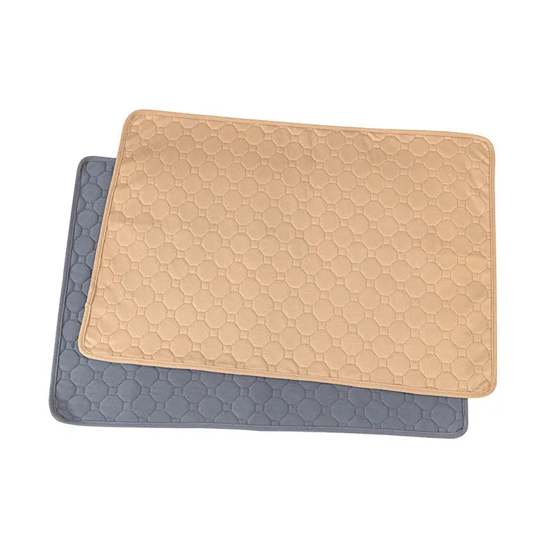 Washable dog pee pads in grey and tan colours showing multi-layer construction and triple-stitch binding
