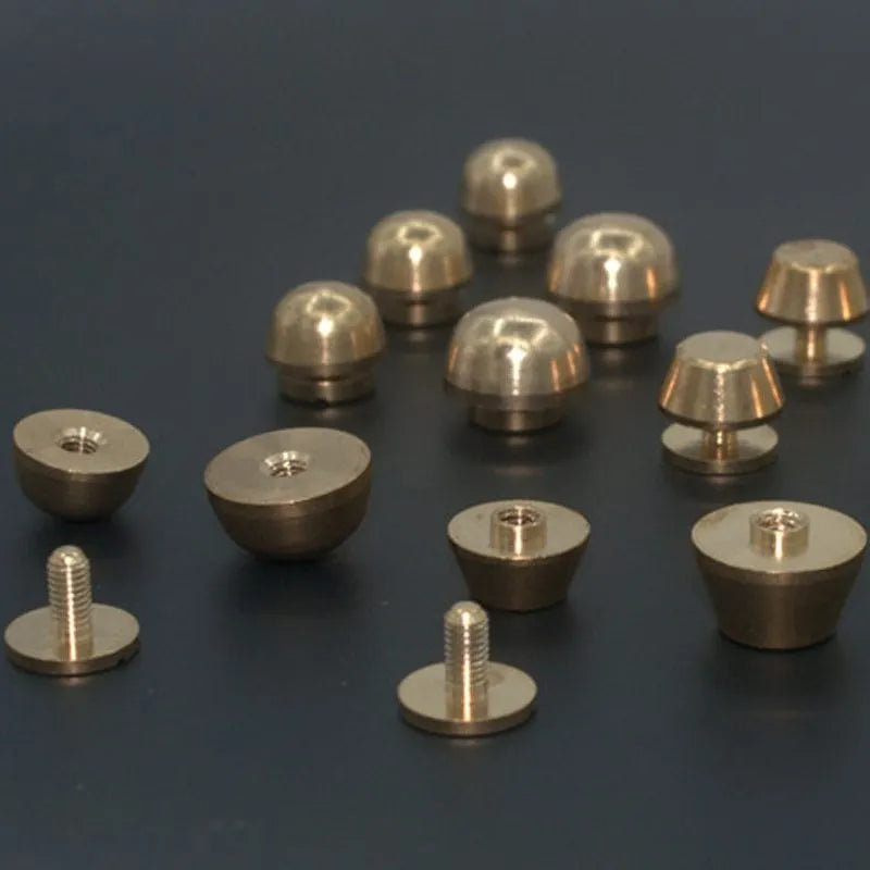 Brass decorative foot nail buckle in round and geometric designs, sizes 10x6mm and 12x7mm.
