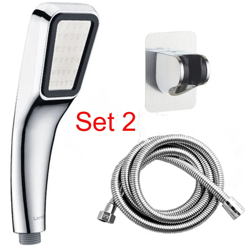 Orange hand-held pressurised shower with hose, set on a bathroom tile background.