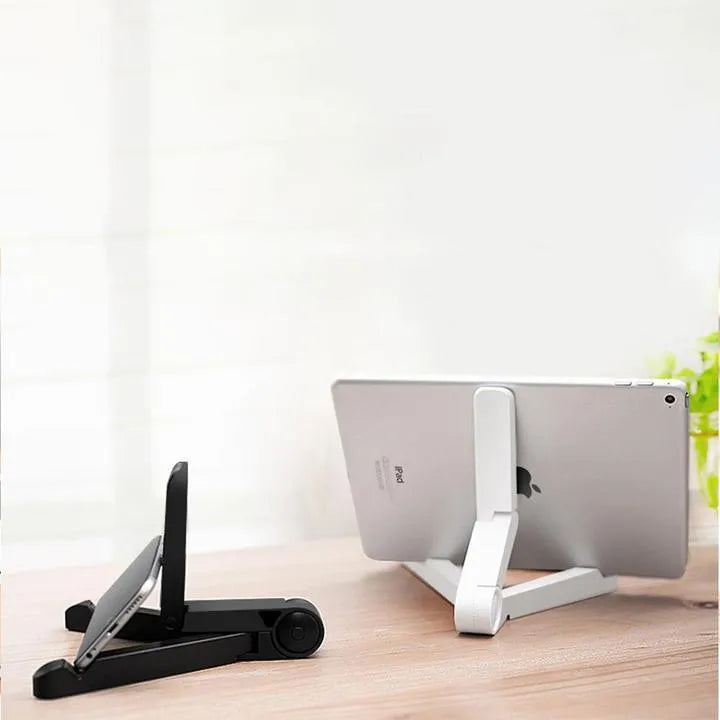 Black foldable tablet holder supporting tablet in landscape position on desk