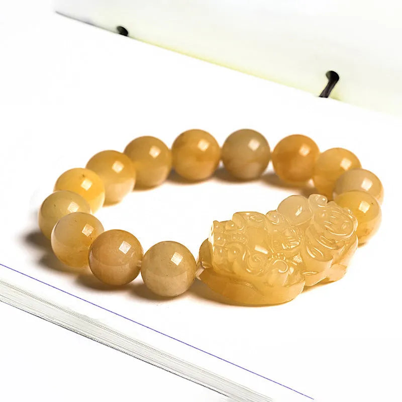 Hand-carved Jinsi Jade money bracelet with traditional coin pendant in golden-threaded stone