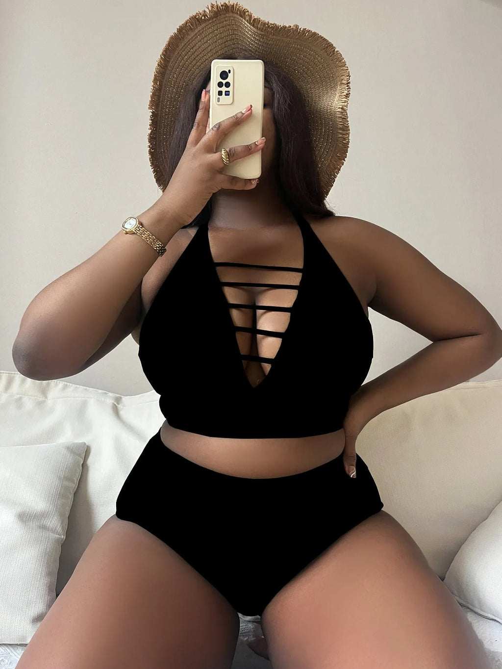 Plus size black halter bikini with adjustable cross straps and high waist briefs on mannequin