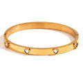 Stainless steel peach heart bracelet for women in a golden electroplated finish.