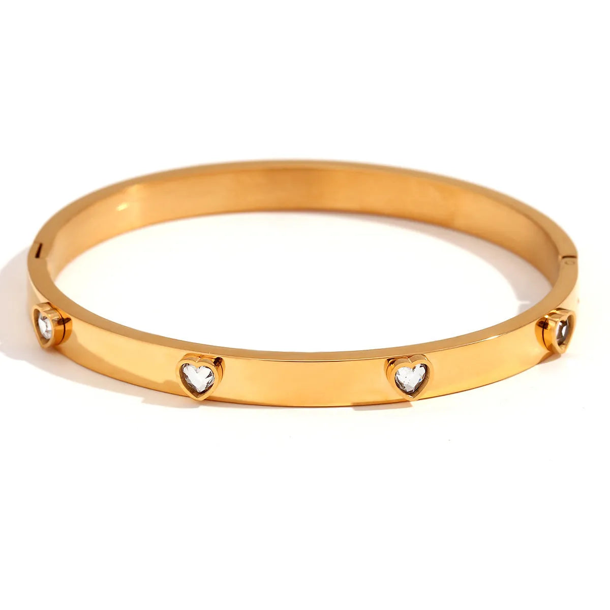Stainless steel peach heart bracelet for women in a golden electroplated finish.
