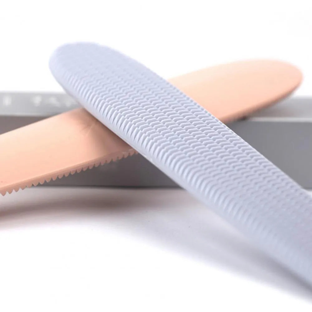 Grey cat grooming comb with tongue massager design showing narrow and wide ends
