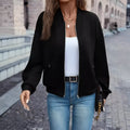 Women's black zip jacket with long sleeves and faux pocket design