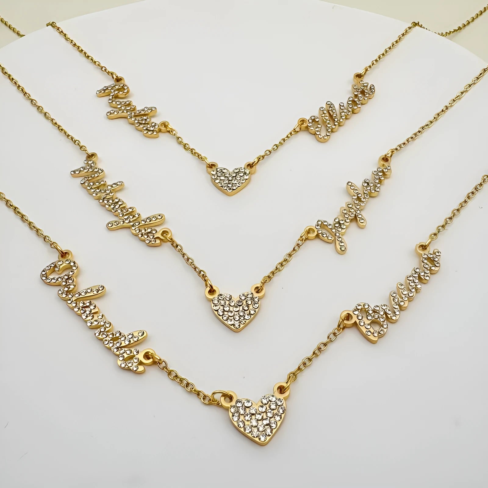 Customised diamond inlaid multi name necklace on stainless steel O-shaped chain, gold finish, with heart charms