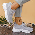 Women's low-top mesh platform sneakers in beige with front lace-up and round toe.