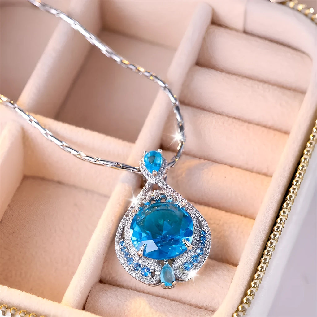 Blue geometric pendant necklace with fireworks cut crystal gems on water wave chain