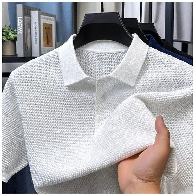 Loose fitting short sleeve cotton pullover sweater in a solid colour on a hanger