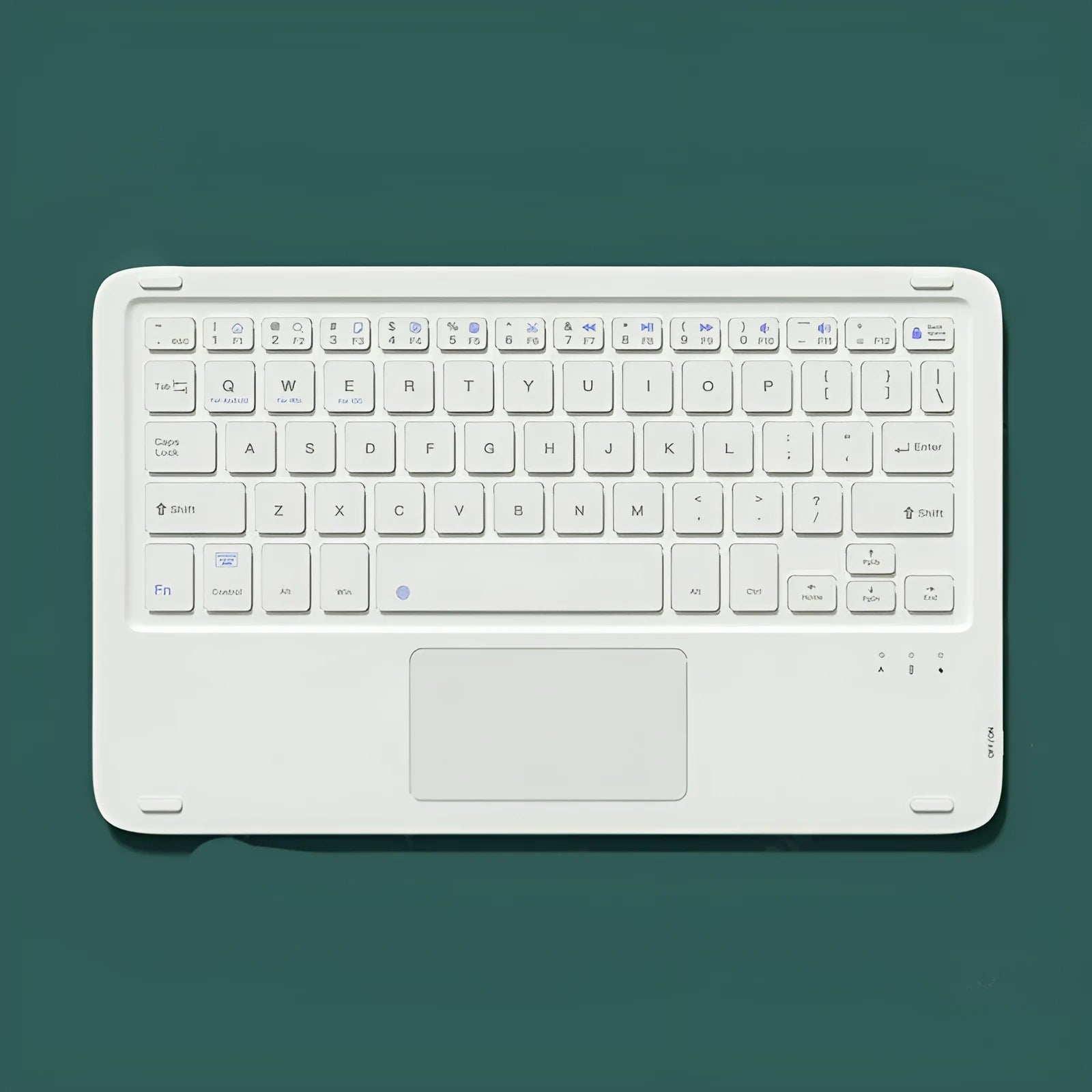 Pink wireless Bluetooth keyboard and rechargeable mouse set on a desk next to a tablet.
