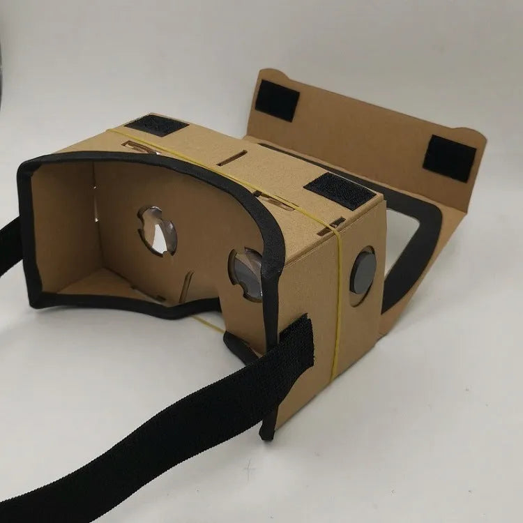 Pink and white cardboard VR glasses with rubber head strap and magnetic button for smartphones.