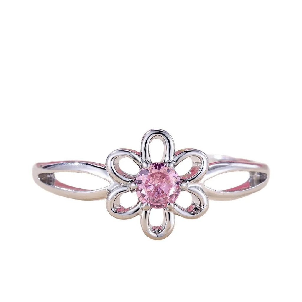 Lady's copper ring with hollowed flower design in platinum pink diamond colour showing size options