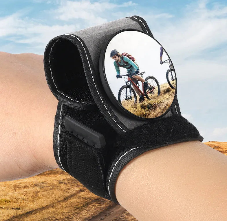 Black wrist-mounted bicycle rear-view mirror with adjustable arm for cycling safety