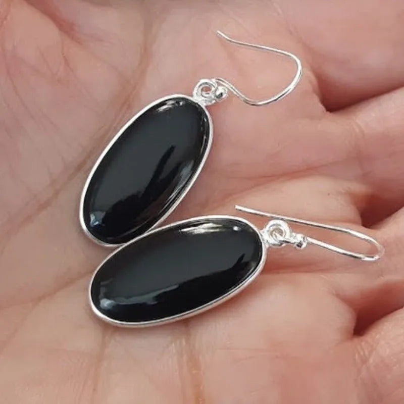 Women's oval black agate pendant earrings with geometric Chinese design on silver-style alloy