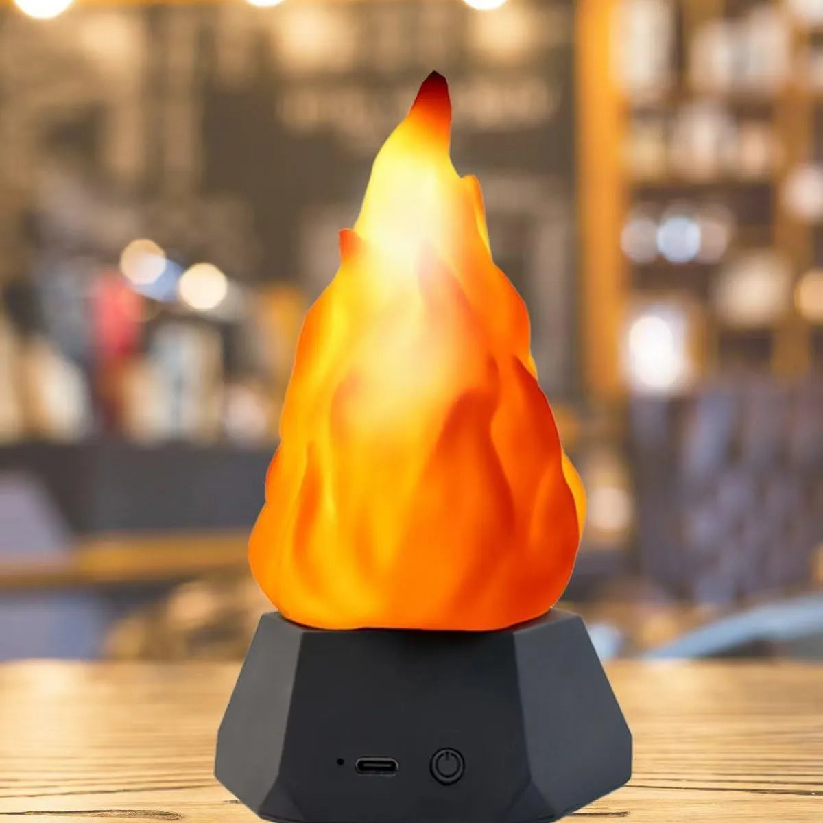 Flame-shaped decorative night light with black charging base for indoor and outdoor use