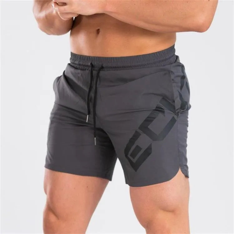 Men's black knee-length quick-dry nylon running shorts laid flat, showing mid-waist and sport design.