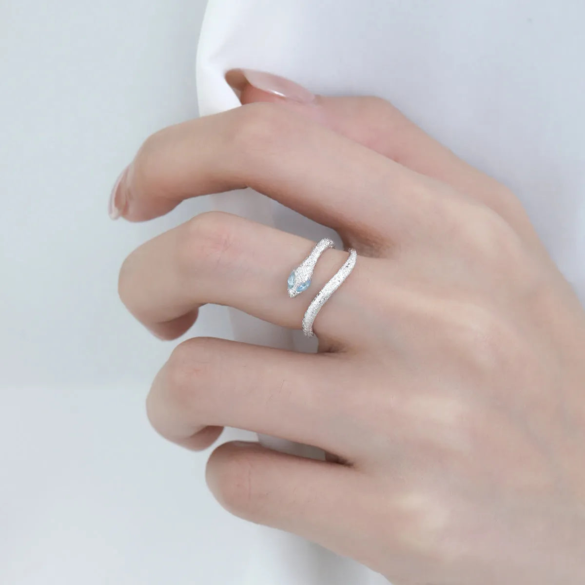 Silver electroplated snake ring with adjustable opening in platinum white gold colour
