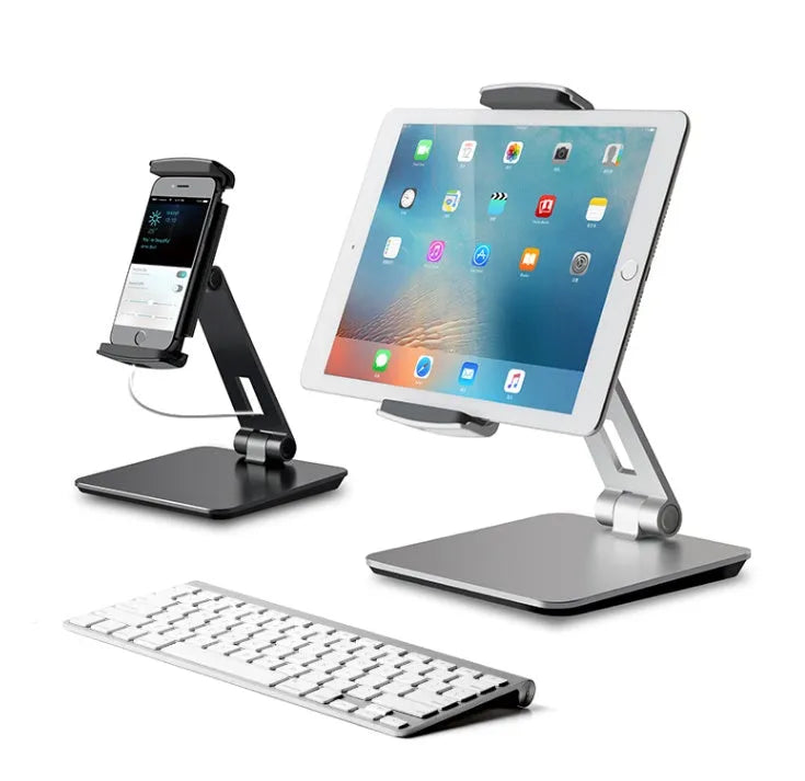 Black folding phone tablet holder with 360° rotating head on desktop