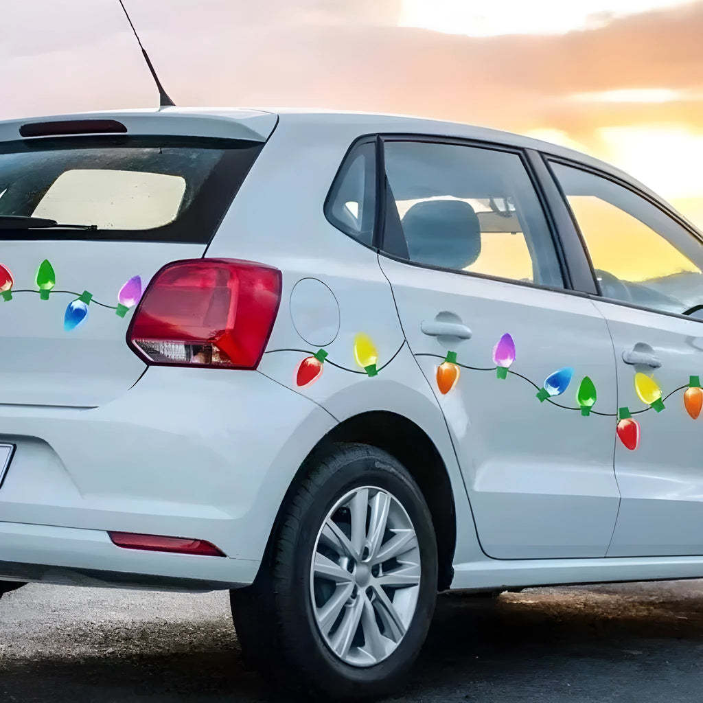 Set of magnetic reflective Christmas light bulb and wire stickers on a car door.