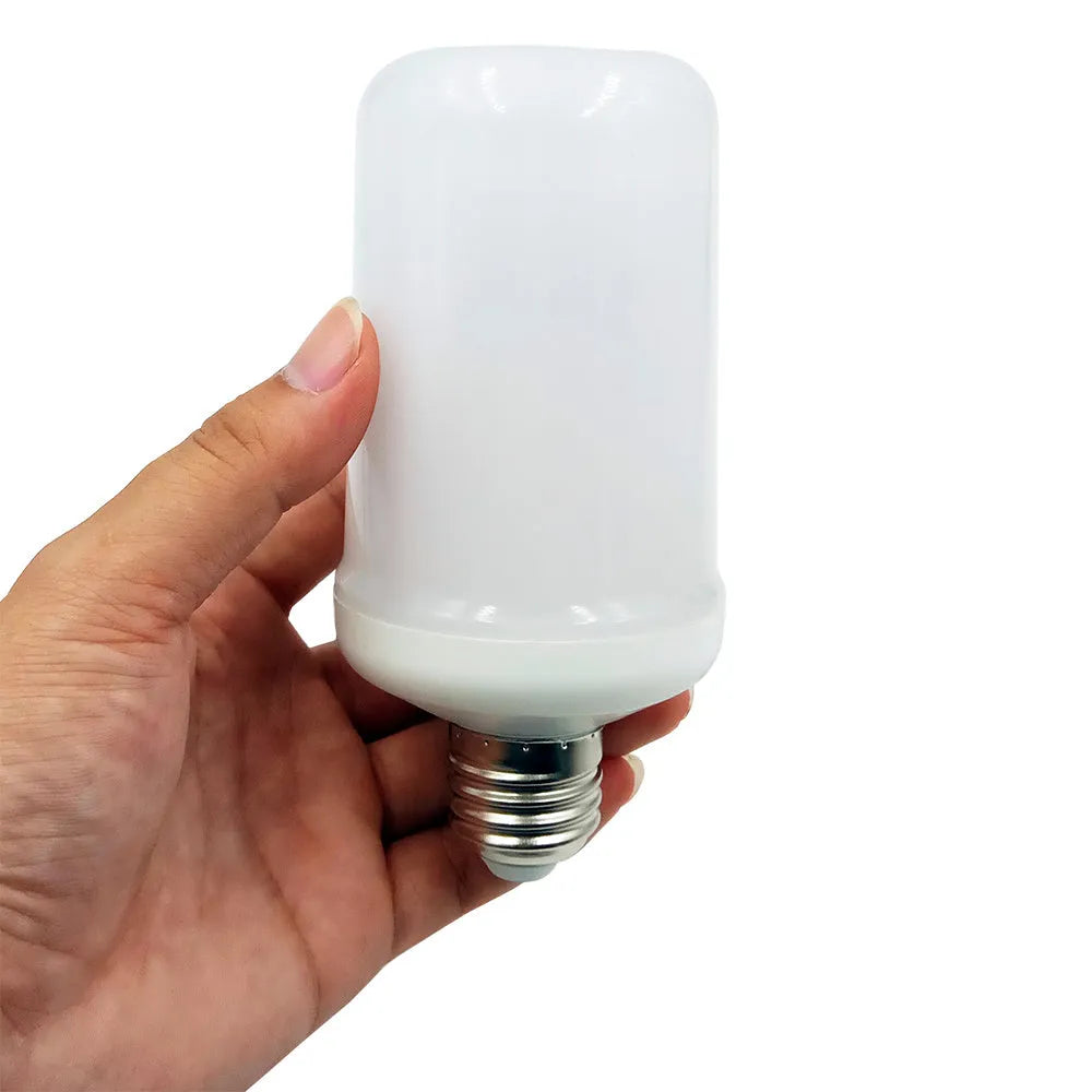 Close-up of a decorative LED light bulb emitting a realistic orange and yellow flickering flame effect.