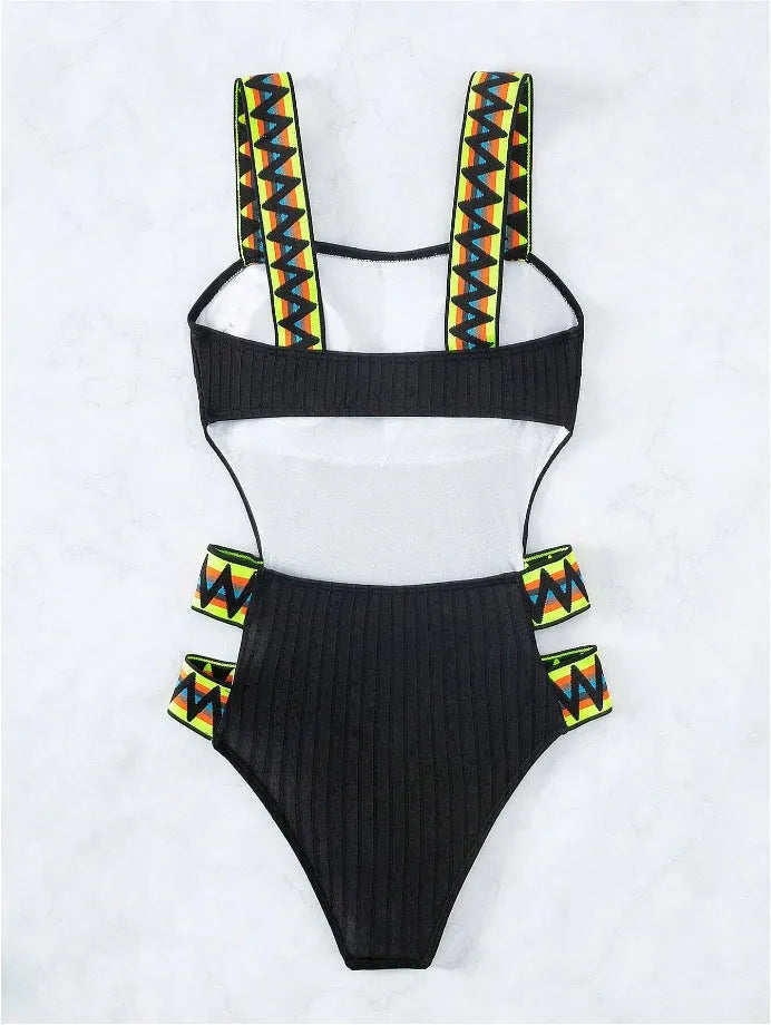 Women's black and orange solid colour one-piece polyester swimsuit on hanger