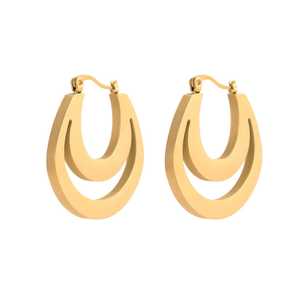 Geometric minimalist French earrings in gold and steel colours with round ring design elements