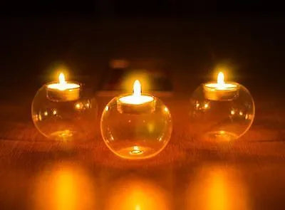 Handmade European style round hollow glass candle holder in three sizes.