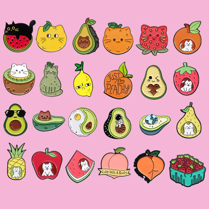 Colourful cartoon fruit design metal brooch pin with a letter shape on a white background.