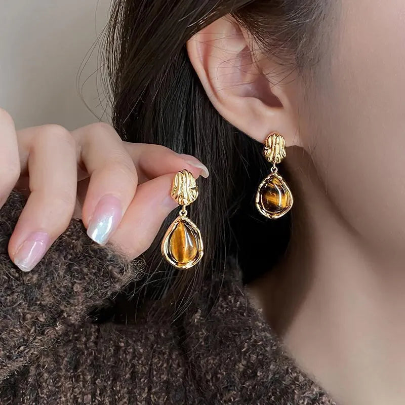 Handmade geometric alloy earrings set showing three styles with electroplating and tassel elements