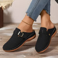 Women's casual wedge slippers in black with closed toe and rubber sole, shown from the side.