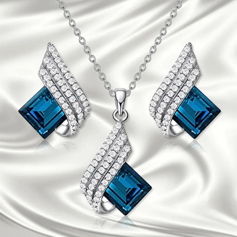Necklace and earrings jewellery set with alloy pendant and glass details on cross chain