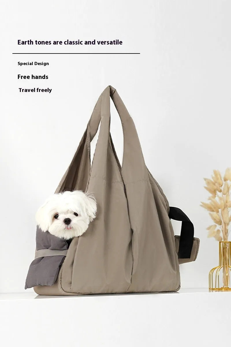 Apricot-colour cloth pet carrier handbag for small pets, showing single handle and rectangular shape.