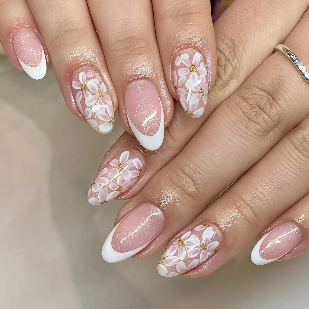 C625 short glossy almond fake nails with French manicure, glitter, and pink powder flowers.
